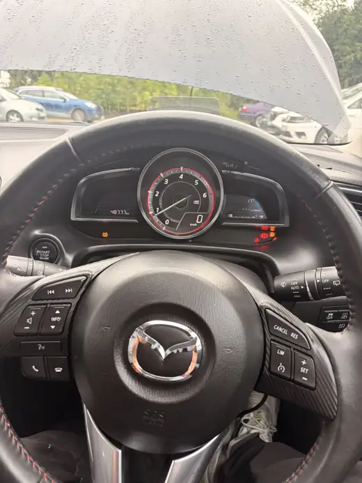 Dashboard and steering wheel, 2015 Mazda 3